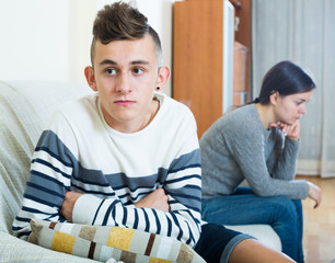 Frustrated  mother and angry teen quarrelling  in domestic inter