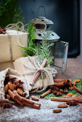 Boxes Decorated with Linen Cord and Green Branch of Coniferous