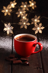 Hot chocolate and chocolate pieces.