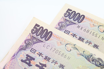 Stack of japanese currency yen or Japanese banknotes