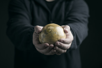 Hands holding earth globe