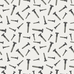 Seamless vector pattern with tools. Chaotic background with screws on the grey backdrop.