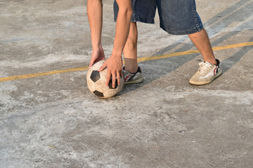 fell vacant soccer ball on concrete floor (street soccer)