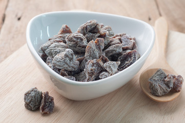 Pickled plum on the palette,dessert of Asian Foods.