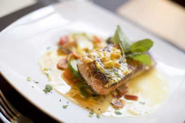 Grilled salmon with sauce and herbs