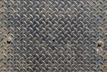 Background of metal diamond plate in silver color.