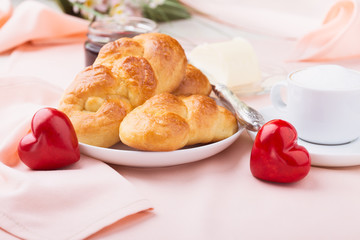 Delicious breakfast with a nice cup of coffee, fresh braided bread