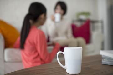 Asian women are relaxing in the living room