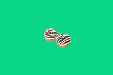 miniature donut model from japanese clay on green background