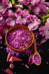 Spa background-pink petals ,salt in bowl