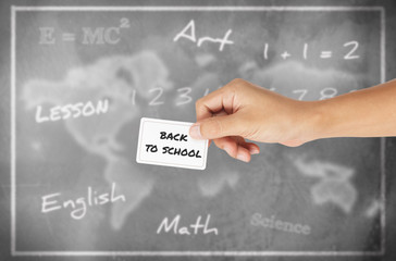 Hand holding card with word of 