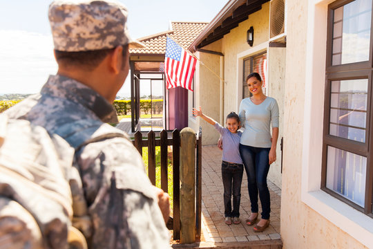 Young Family Welcoming Military Father Returning Home