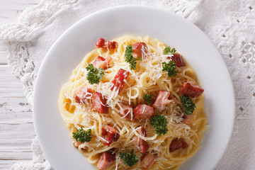 Italian pasta carbonara close-up on a plate. horizontal top view
