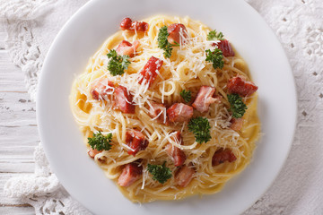 Italian pasta carbonara on a plate. horizontal top view
