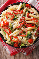 Primavera Italian pasta with vegetables closeup. vertical top view
