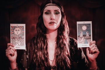 Fortune teller woman showing tarot crads