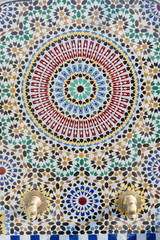 Moroccan style water tap with detailed mosaic