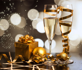 Toasting with champagne glasses against holiday lights