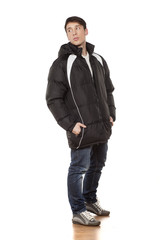 Fototapeta premium young handsome man posing with winter jacket