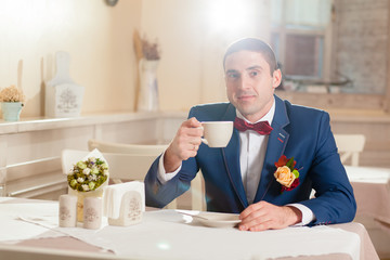 man with cup in a restaurant