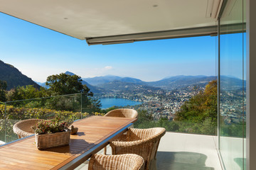 Fototapeta premium Veranda, wooden table and wicker chairs