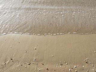 Wave of the sea on the sand beach