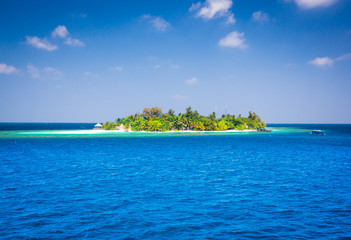 The solitary island and bungalows in the sea .