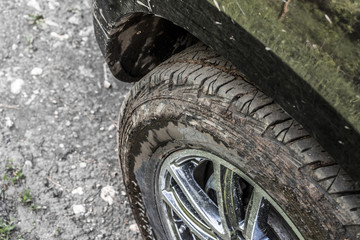 Fototapeta na wymiar Dirty car wheel