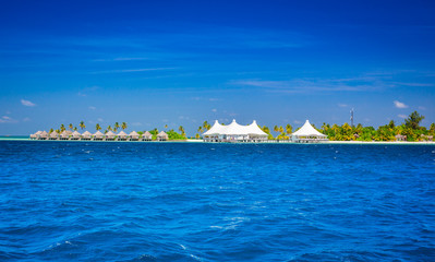 Fototapeta premium The solitary island and bungalows in the sea .
