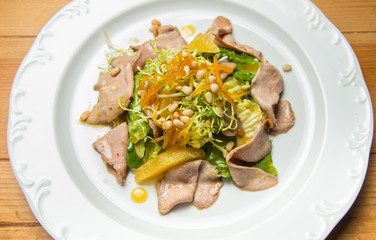 Warm salad with beef and sesame seeds