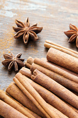 cinnamon sticks and  star anise on wooden background