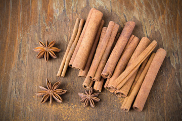 cinnamon sticks and  star anise on wooden background