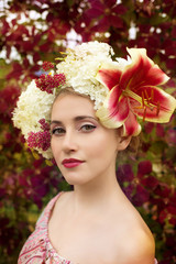 beautiful woman portrait with natural flowers hairstyle