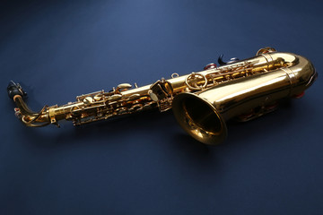 Beautiful golden saxophone on black background