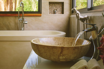 Bathroom Luxury interior decor. Water flow from tap