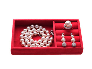Jewelry box with pearl necklace, ring and ear-rings