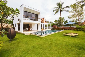 Fotobehang Luxury villa with swimming pool outside exterior view © Annatamila