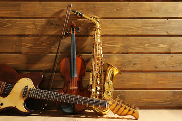 Musical instruments on wooden background