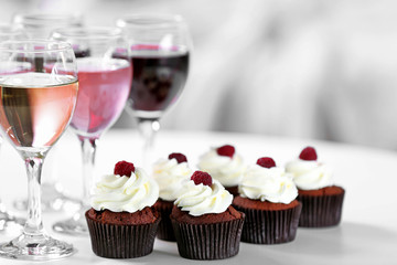 Tasting of wine and chocolate cupcakes, close up