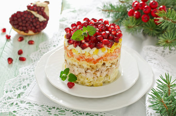 Layered salad from vegetables on the holiday table