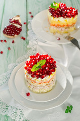 Layered salad from vegetables on the holiday table
