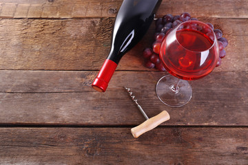 Grapes and wine on wooden background