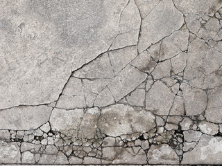 Naklejka premium Cracked concrete texture closeup background