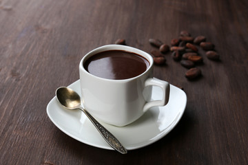 Cacao and coffee beans on wooden background