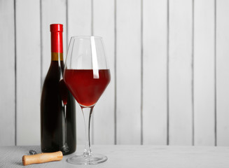 Red wine on wooden wall background
