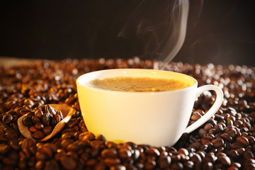 Cup of coffee and coffee beans closeup