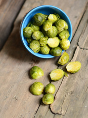 Fresh Brussels sprouts on wooden background