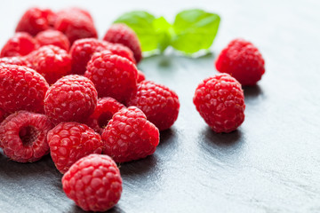 Heap of raspberry on stone
