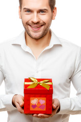 Young man carries heart shaped box