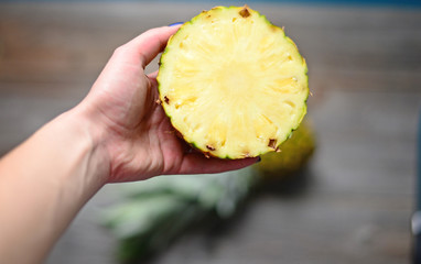 Pineapple in woman hand